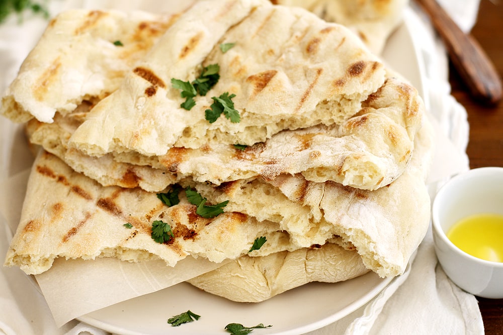 no knead grilled naan on plate