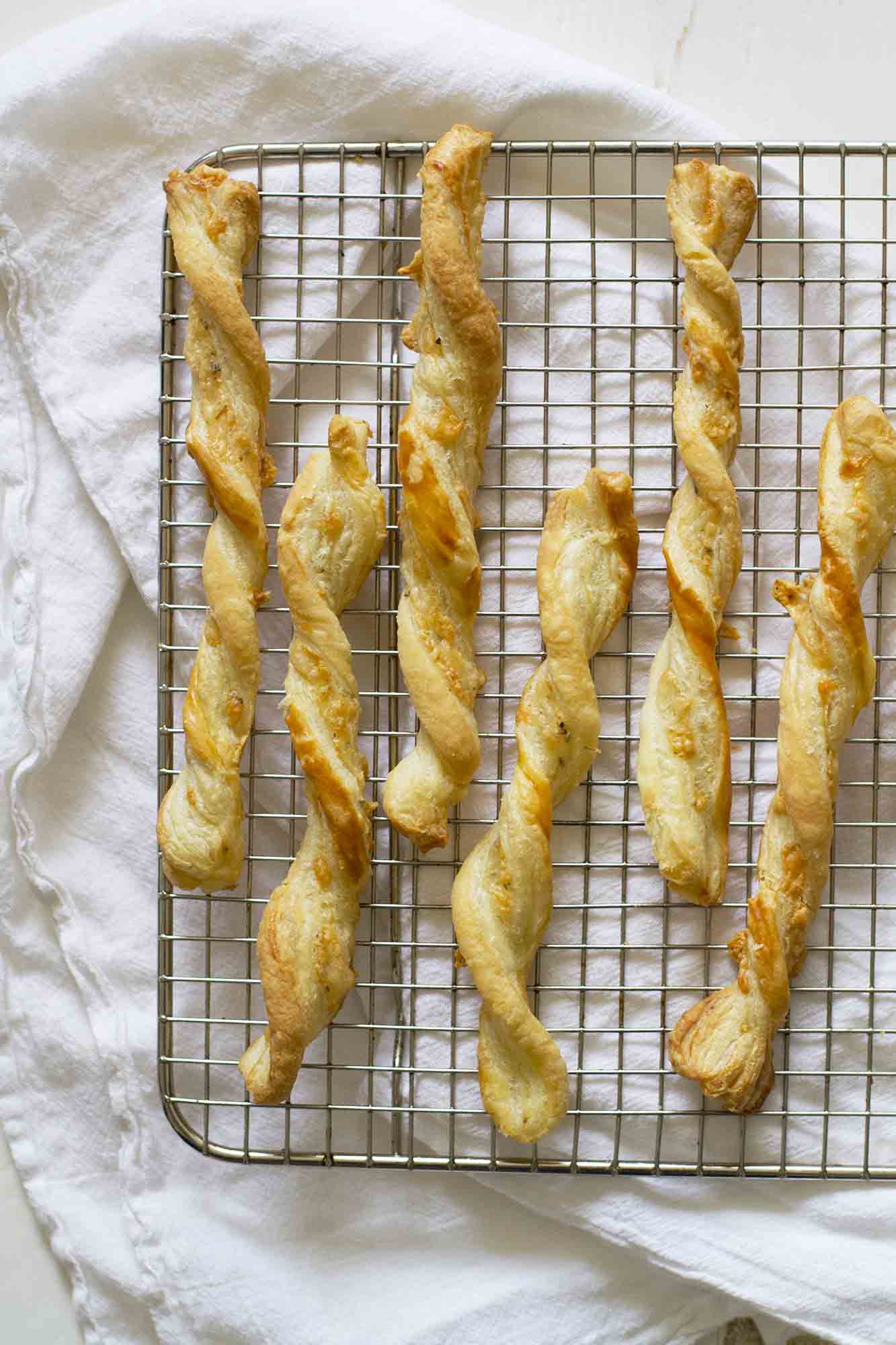 five ingredient cheese straws on cooling rack