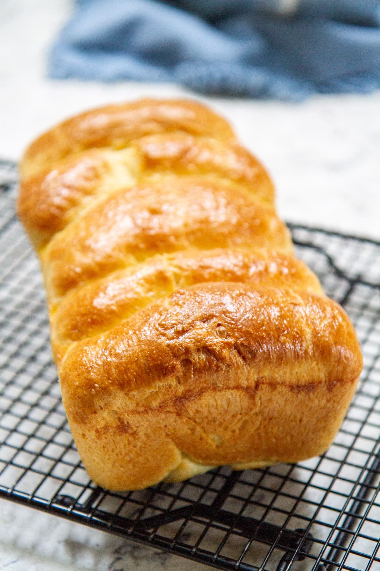 classic brioche loaf bread on cooling rack