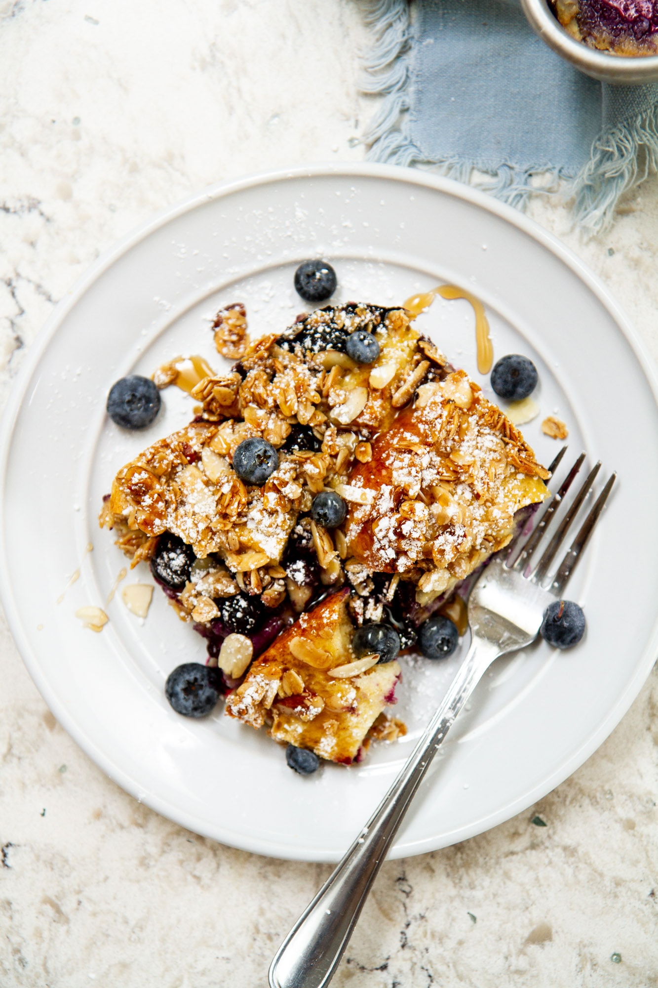 blueberry brioche french toast casserole on a plate
