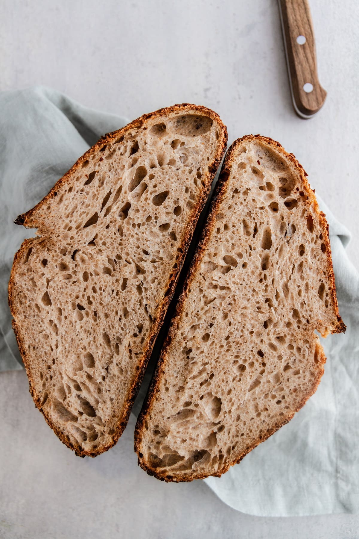 a loaf of sourdough bread cut in half