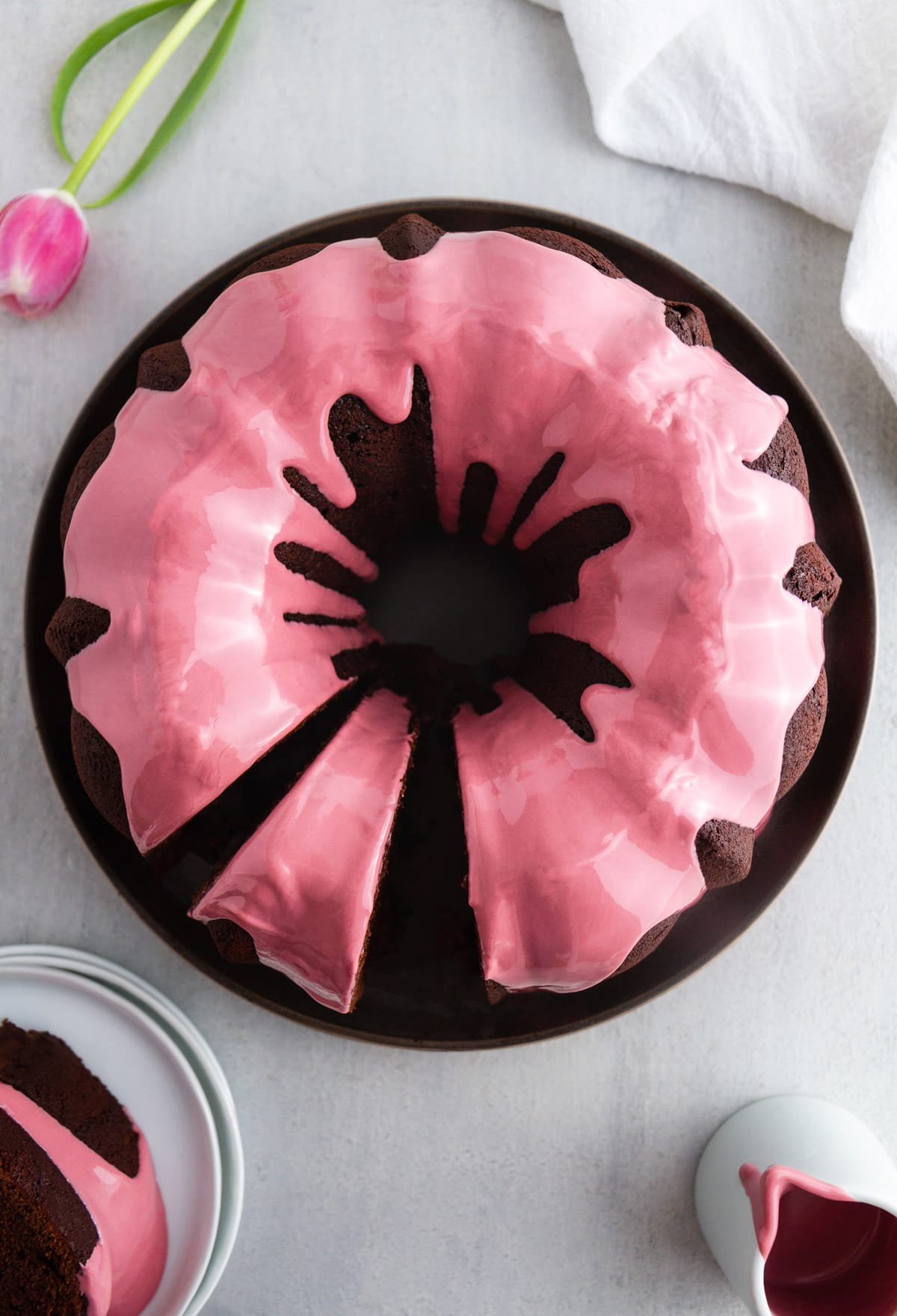 chocolate bundt cake with ruby chocolate glaze on a plate