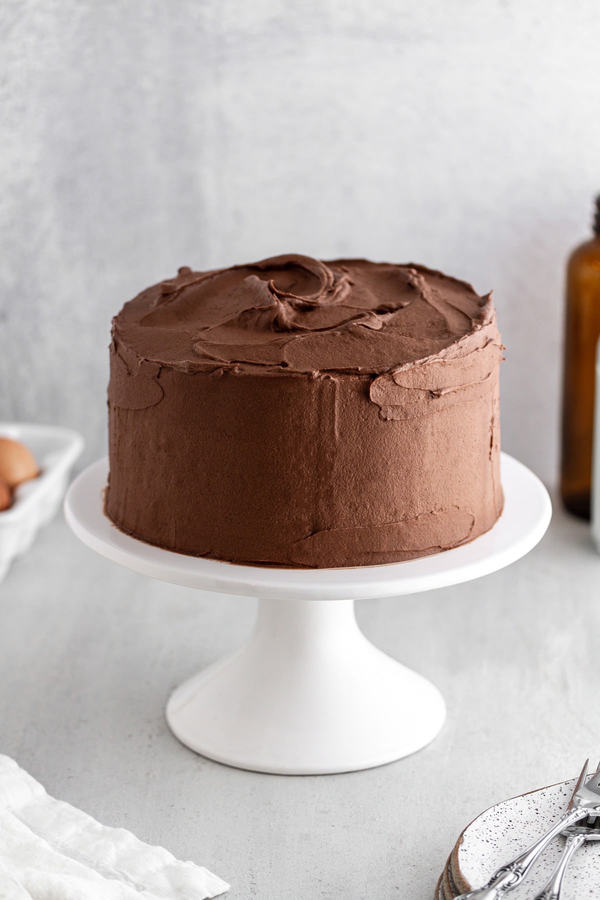 Devil's Food Cake with Chocolate Buttercream Frosting on a cake stand