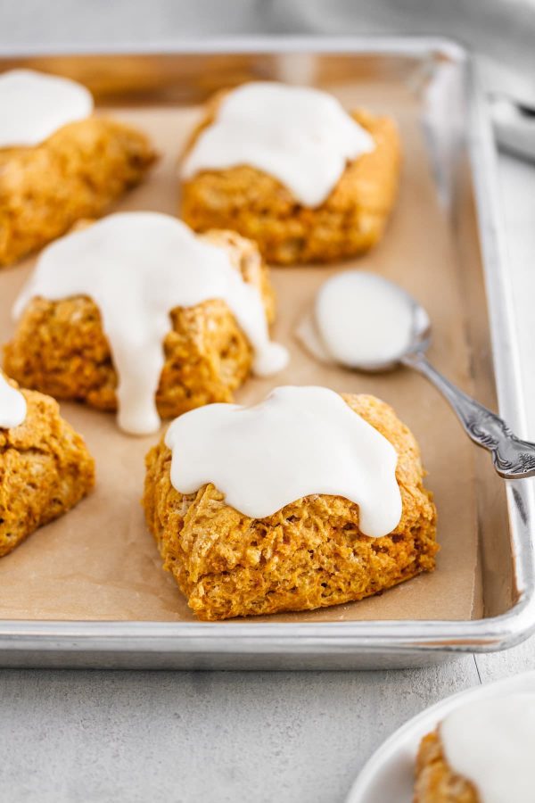 sweet potato biscuits on a baking sheet with marshmallow icing