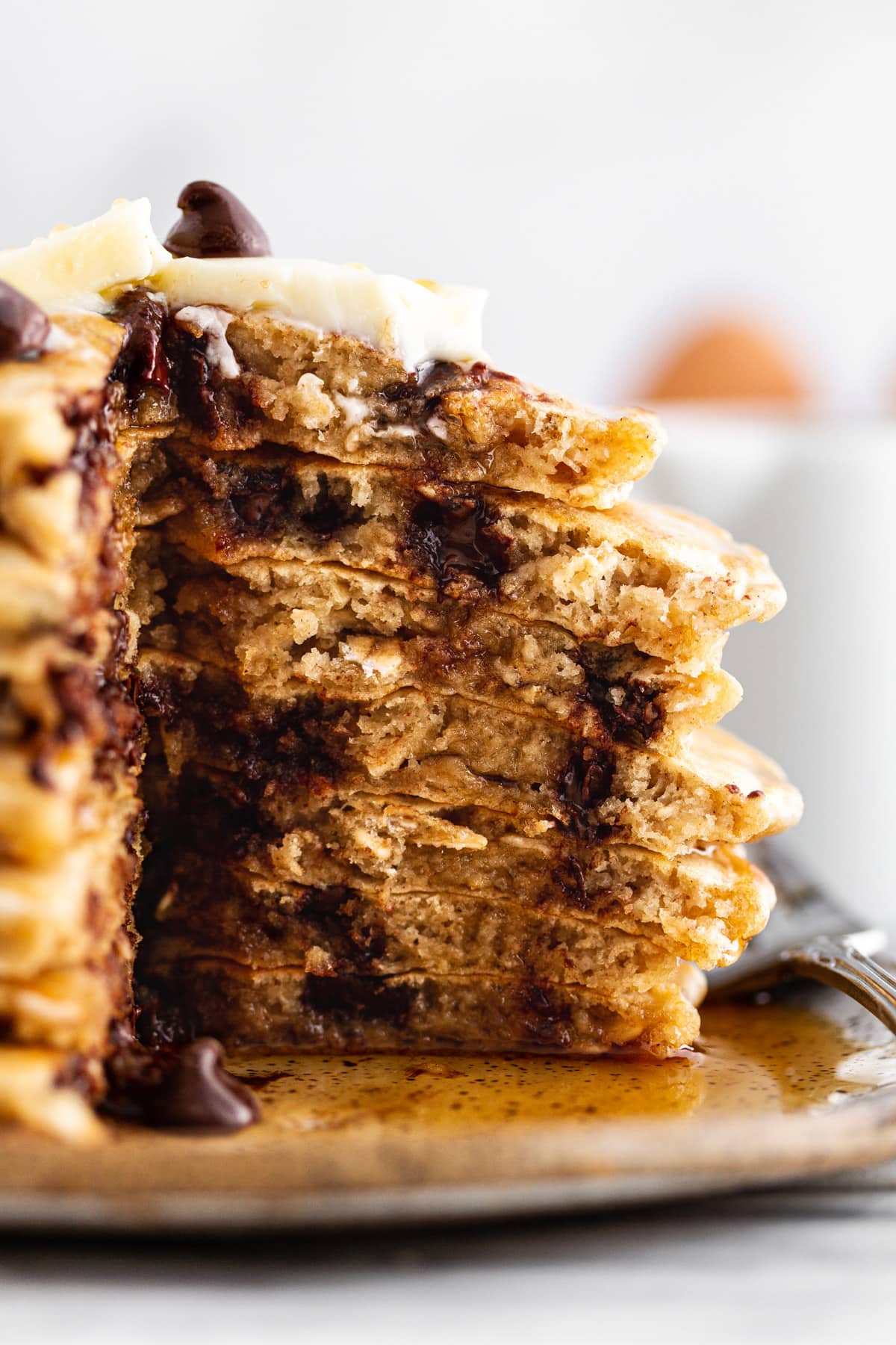 cross-section of oatmeal chocolate chip cookie pancakes on a plate