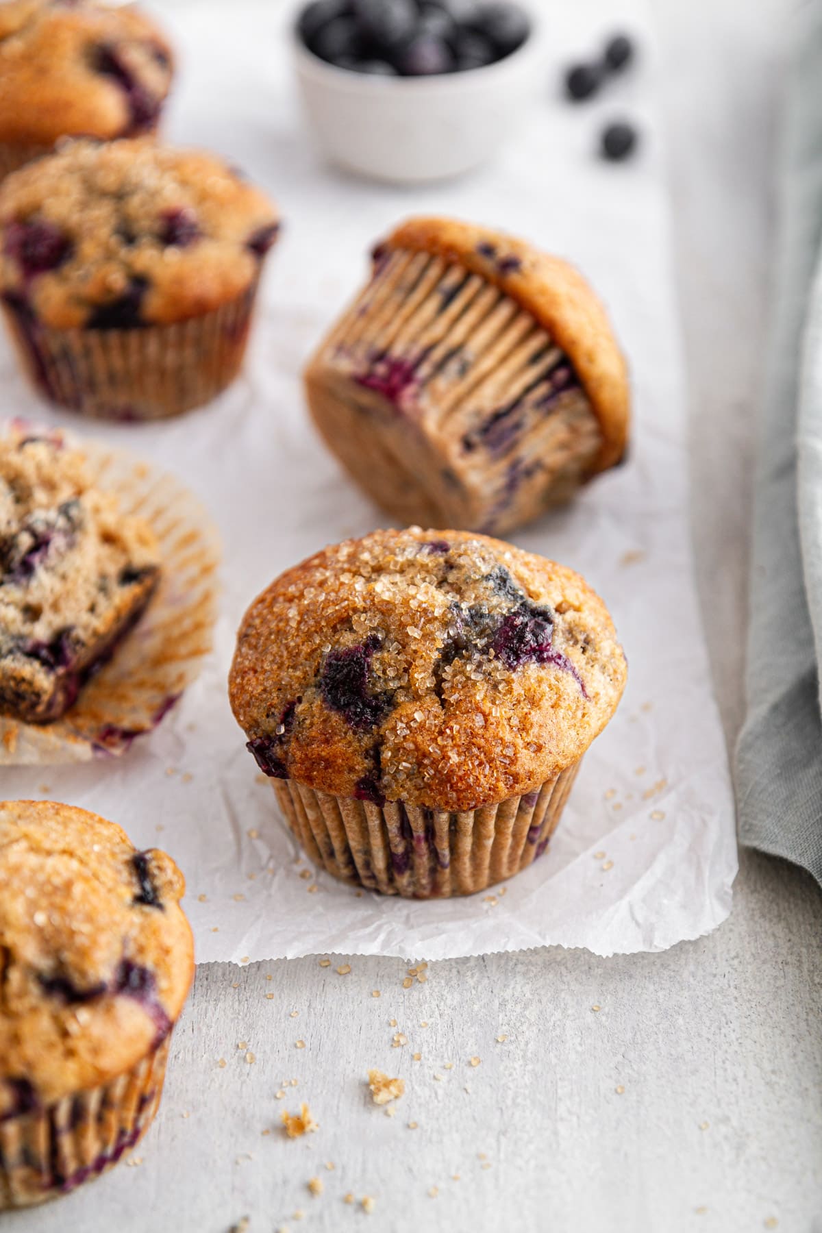 sourdough blueberry muffins on parchment paper