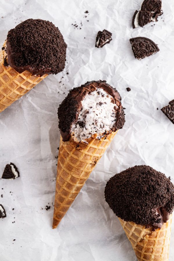 cookies and cream ice cream drumsticks on a surface