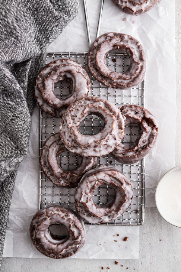 chocolate old-fashioned donuts on a cooling rack