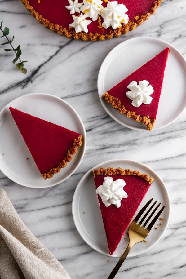 slices of cranberry gingersnap tart on plates