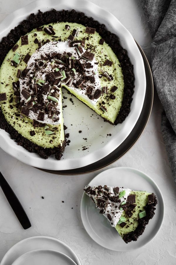 grasshopper pie on a surface with a slice on a plate