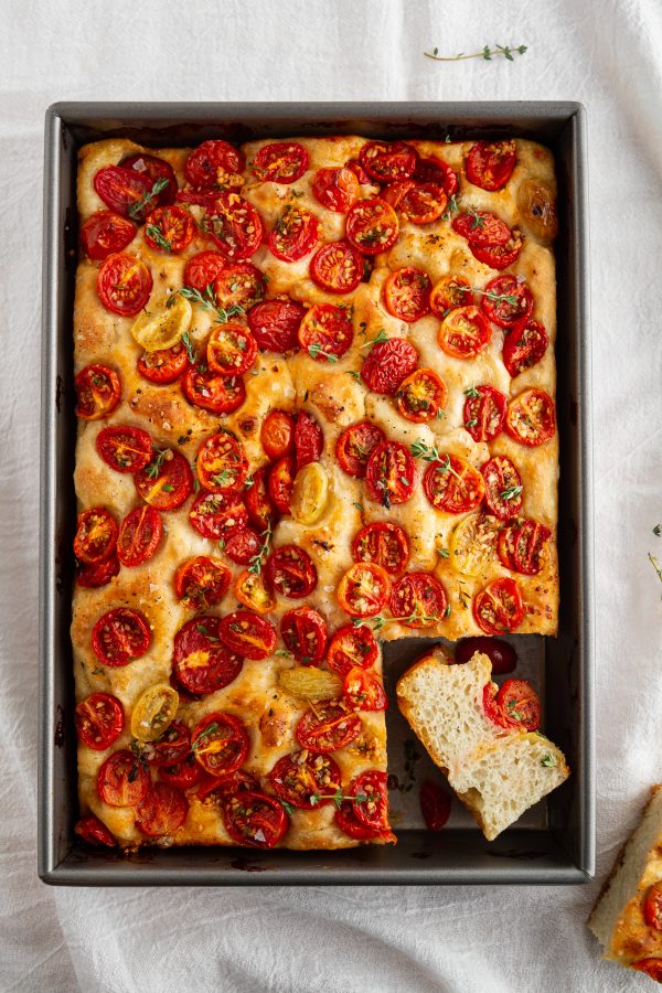 tomato focaccia in a baking pan