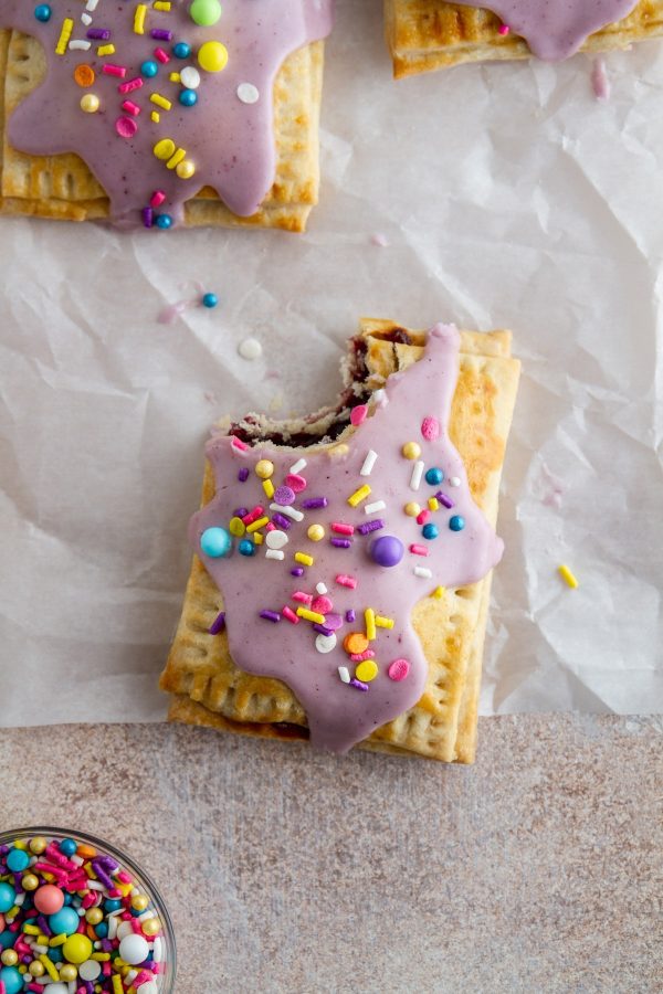 homemade pop tart on a surface with a bite taken out of it