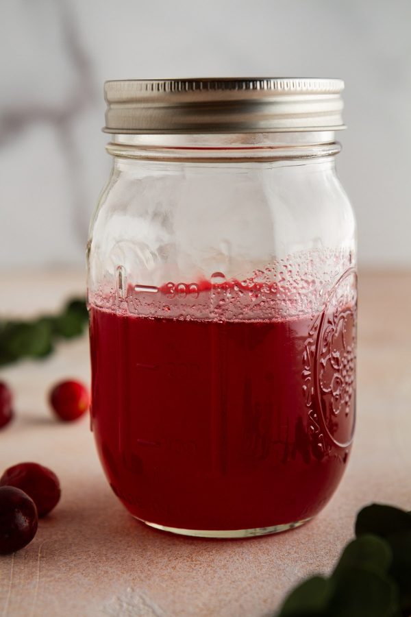 cranberry simple syrup in a jar