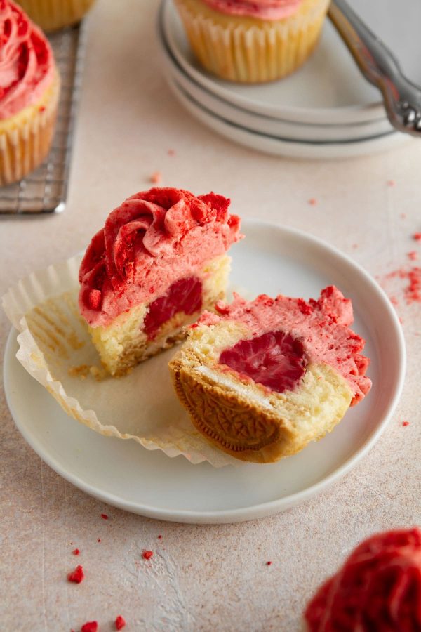 strawberry shortcake cupcake cut in half on a plate